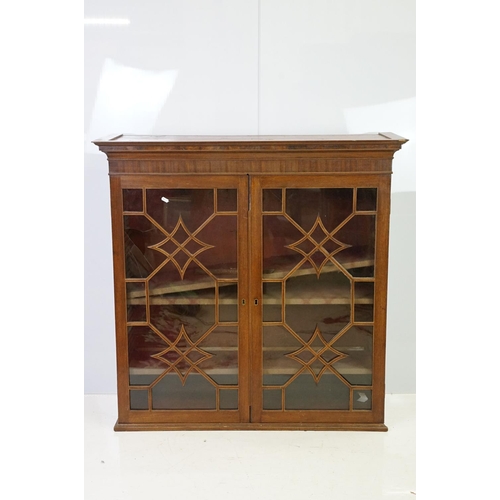 20th century mahogany astragal glazed two door display cabinet fitted with three shelves, 107cm high