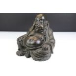 Large cast resin laughing Buddha figurine modelled seated in the lotus position. Measures 25cm tall.