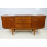 Mid Century vintage Jentique teak wood sideboard having a central bank of three drawers flanked y