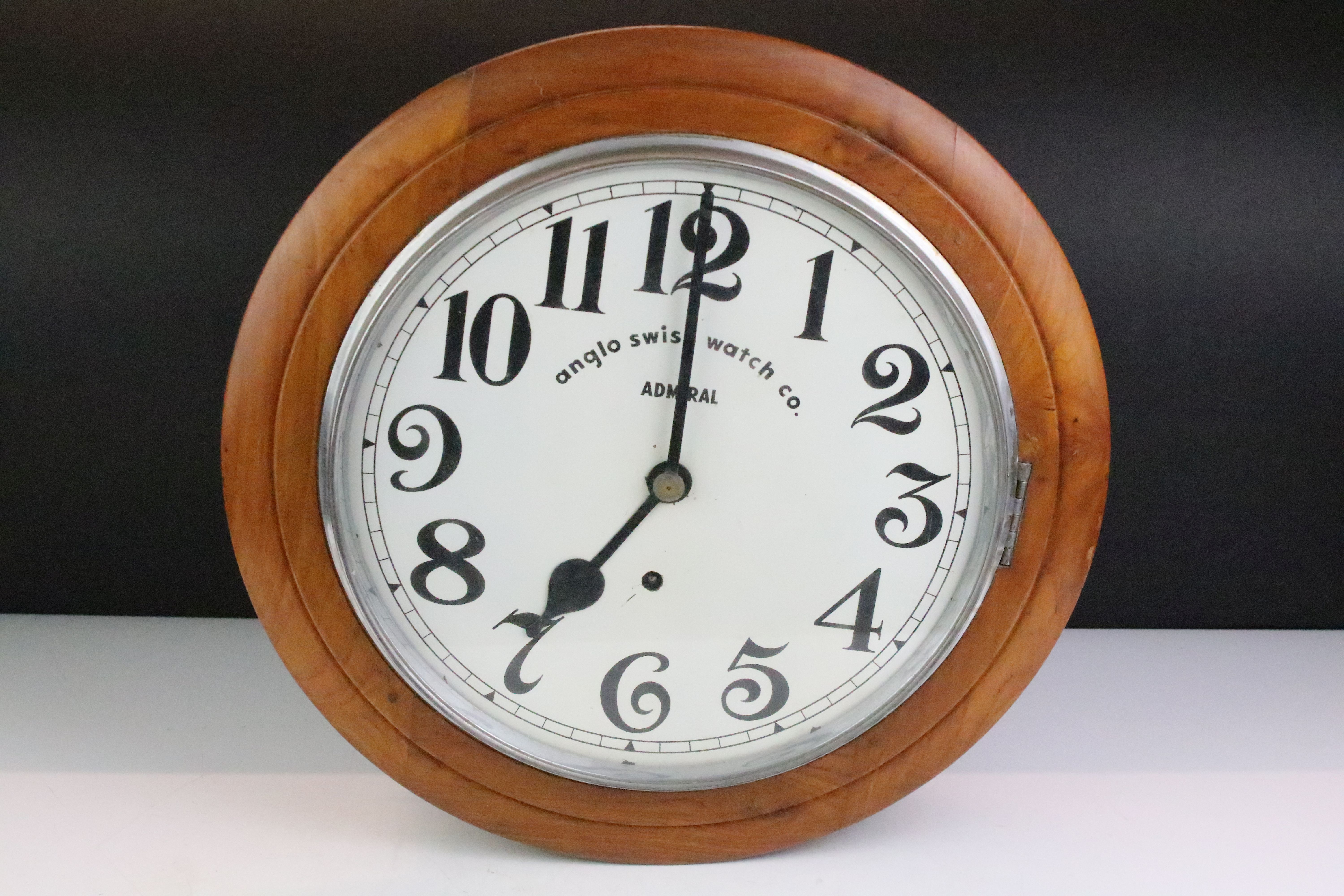 Anglo Swiss Watch Co Admiral station style wall clock having a walnut case with white dial and