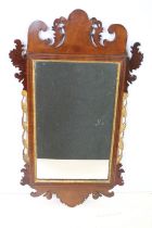 Group of mirrors to include two antique mahogany examples with pierced and carved frames, an oval