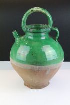 Large pottery green glazed wine ewer, approx 38cm tall