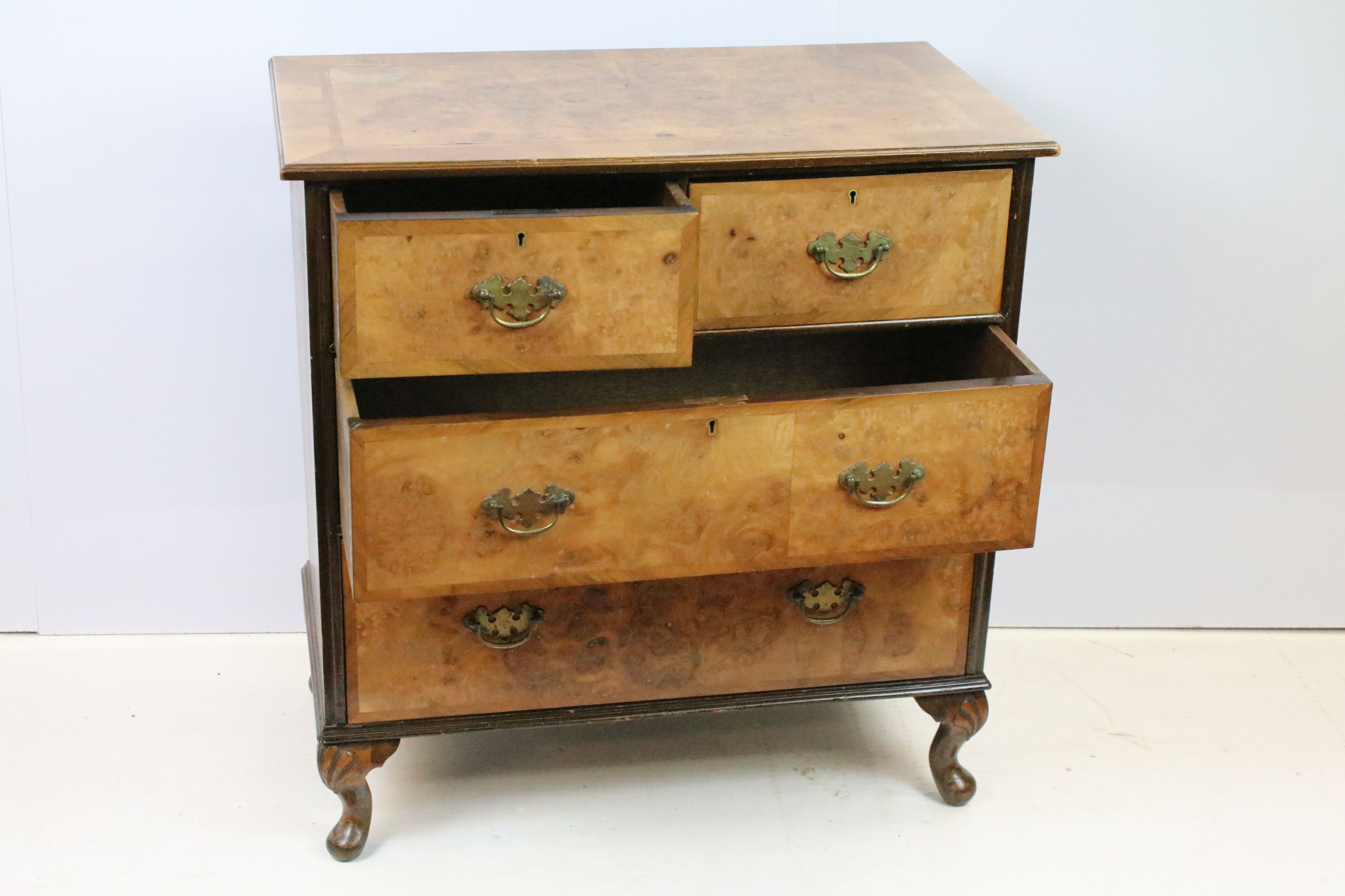 20th Century walnut veneered chest of drawers having two over two drawers with brass swing handles - Image 2 of 8