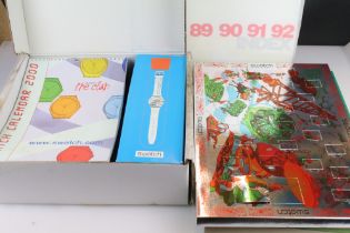 A collection of SWATCH wristwatches within original retail packaging to include the 2000 club pack