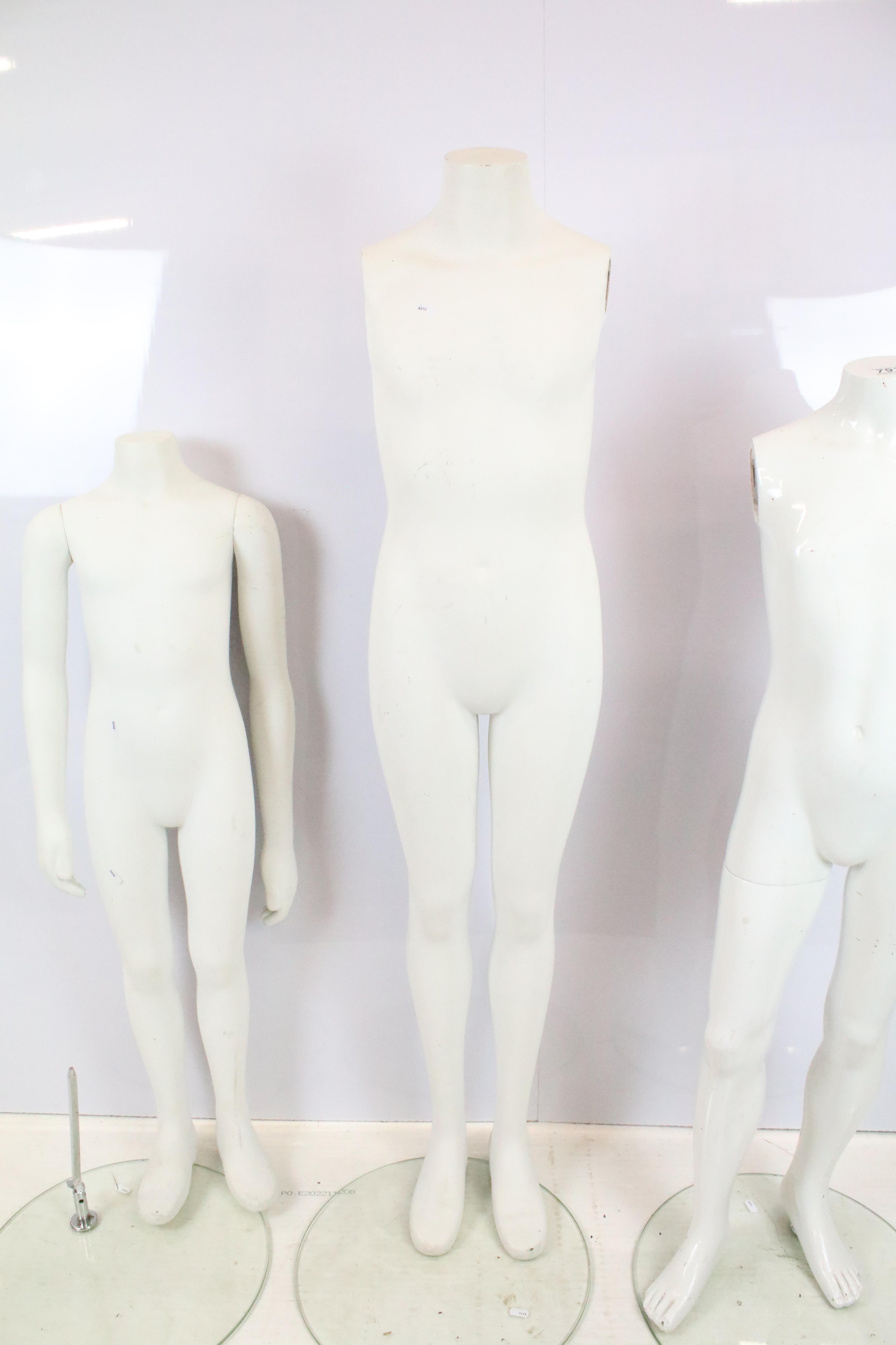 Group of four childrens mannequins together with one torso, all raised on round glass basses. - Image 5 of 6