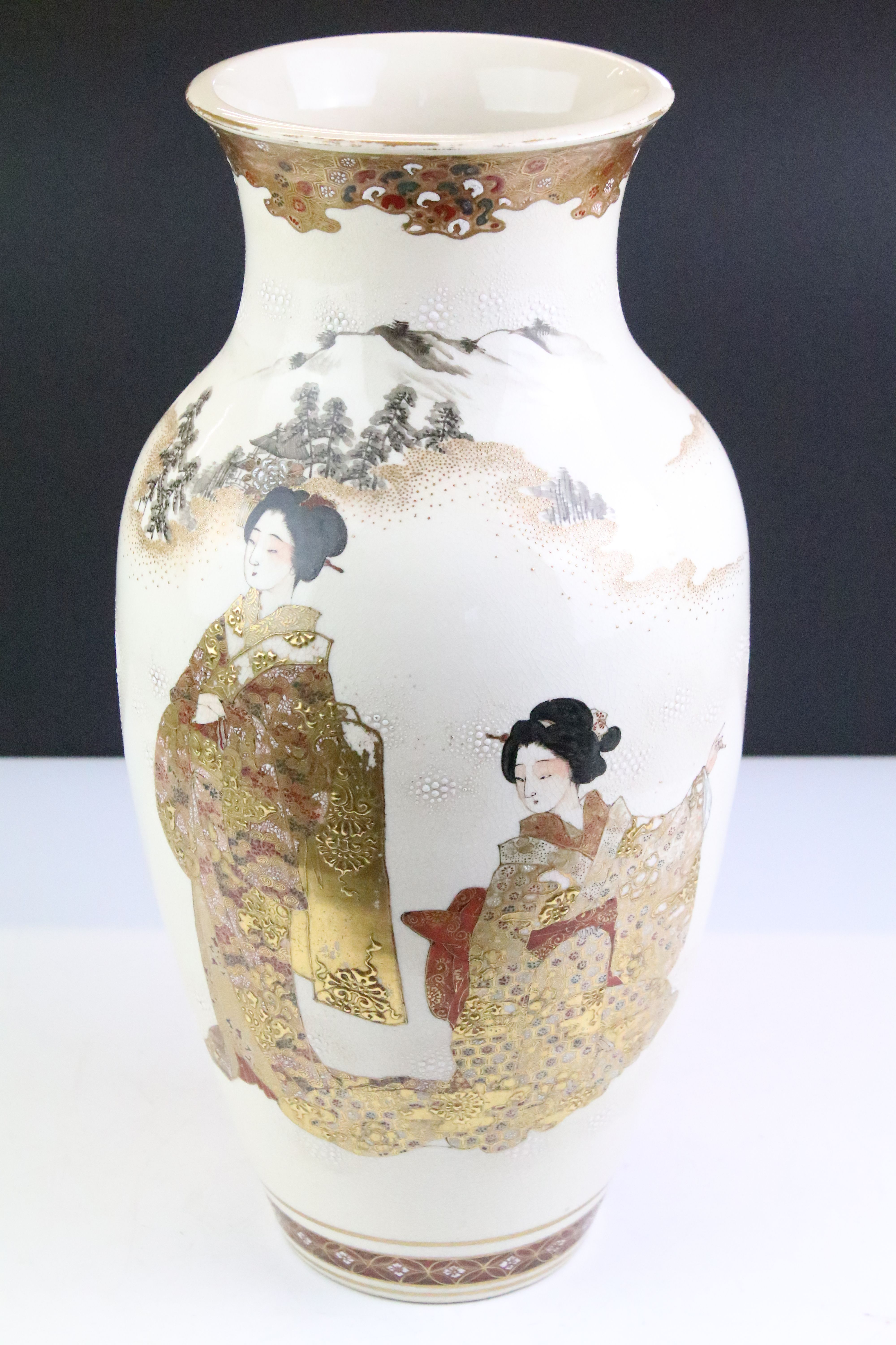 Japanese Kutani vase of baluster form, decorated with female figures with mountains beyond, approx