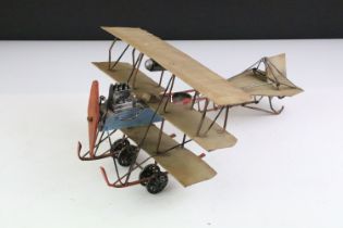 20th Century old painted metal model tri plane with articulated details. Measures 32cm wide.