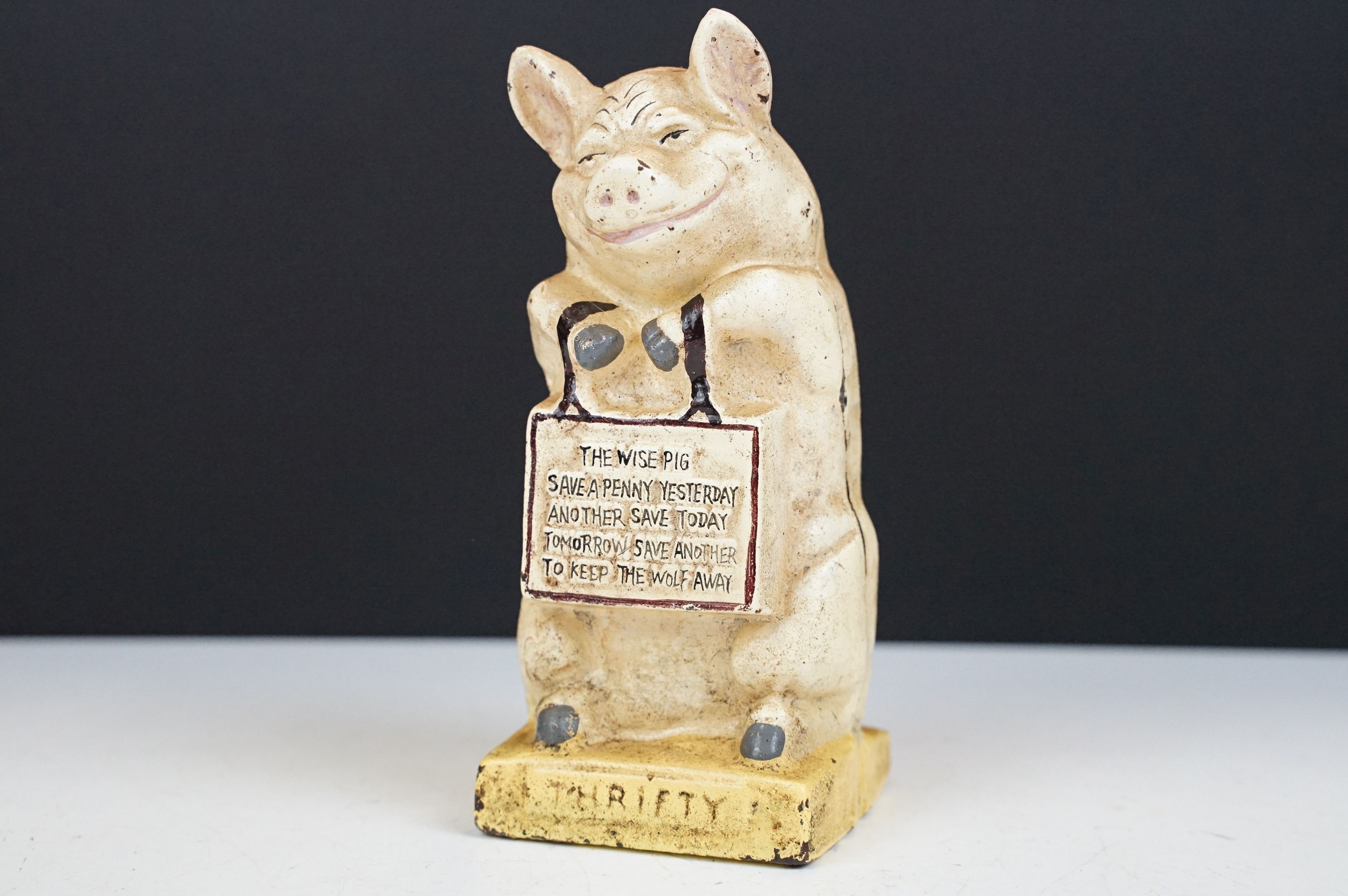 Vintage cast iron ' Thrifty ' money savings bank modelled as a pig, approx 16cm tall