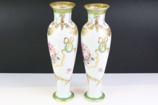 Pair of late 19th / early 20th century porcelain vases of elongated baluster form, with hand painted