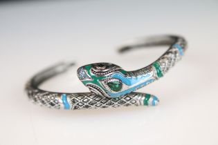 A ladies bangle bracelet with enamel decoration in the form of a snake, marked 925 to the verso.