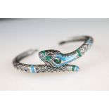 A ladies bangle bracelet with enamel decoration in the form of a snake, marked 925 to the verso.