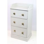 Painted pine chest of drawers having a set of three drawers with brass knob handles and gallery top.
