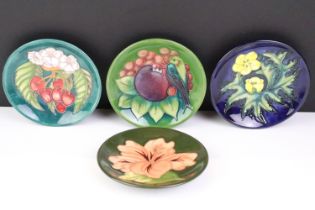 Four Moorcroft small shallow dishes, comprising: Hibiscus pattern, Finch and Fruit pattern,