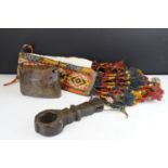 A hand carved wooden butter ghurra churner key, carved wooden cow bell and embroidered animal /