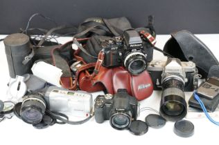 Assorted collection of cameras and camera equipment to include Nikon F3/T, Nikkormat camera body