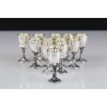 A collection of twelve silver plated menu holders in the form of wine goblets.