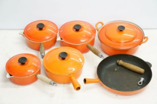 Le Creuset Volcanic Orange ware including Four Saucepans with lids (sizes 18, 20 and two others) and