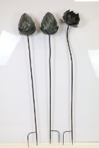 Three large contemporary metal garden sculptures in the form of flowers, tallest approx 158cm