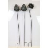 Three large contemporary metal garden sculptures in the form of flowers, tallest approx 158cm