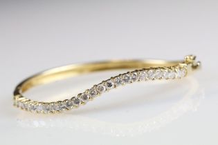 18ct yellow gold serpentine shaped diamond bangle