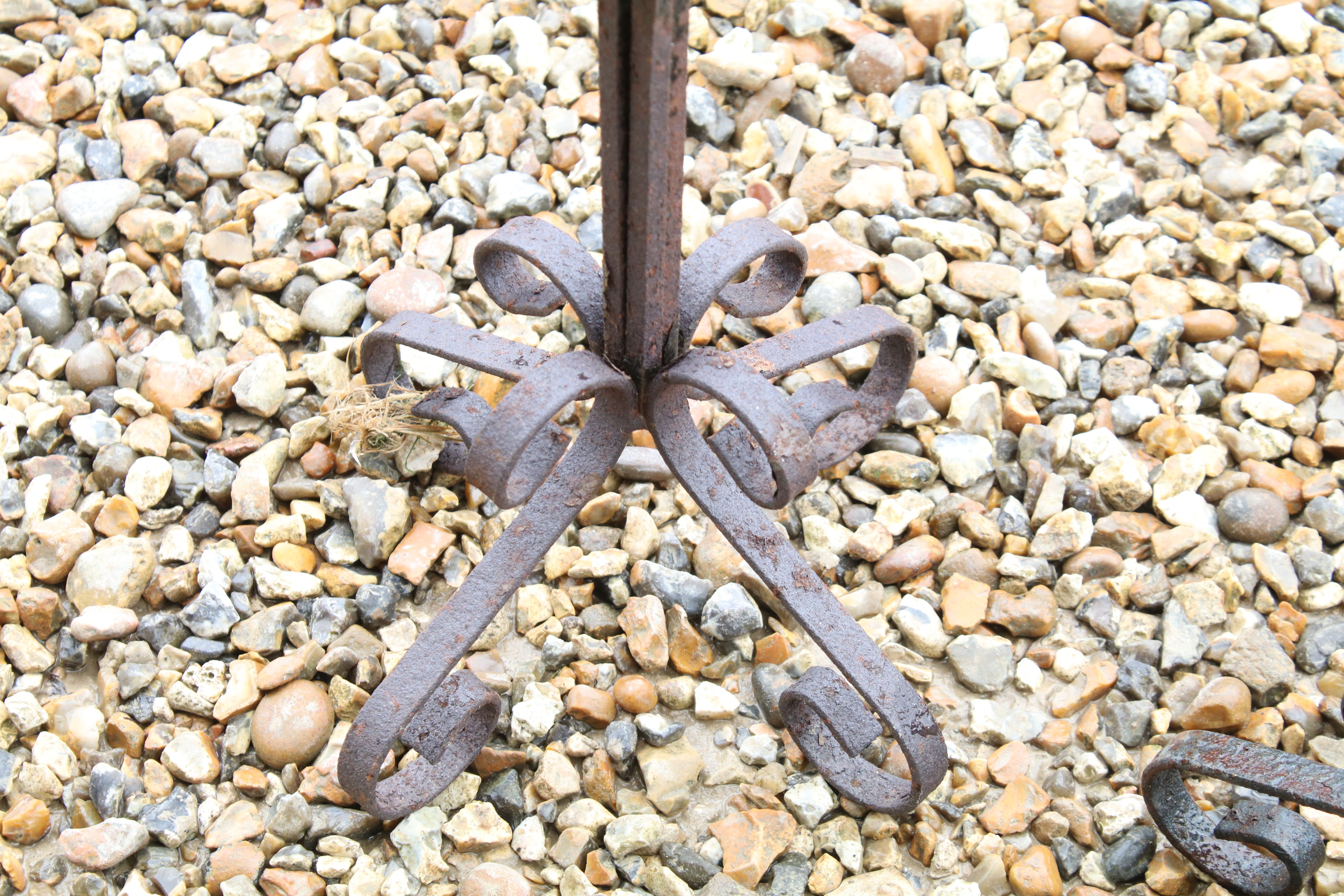 Set of three wrought iron floor standing candlesticks with spiralling to support, approx 62cm high - Image 4 of 4