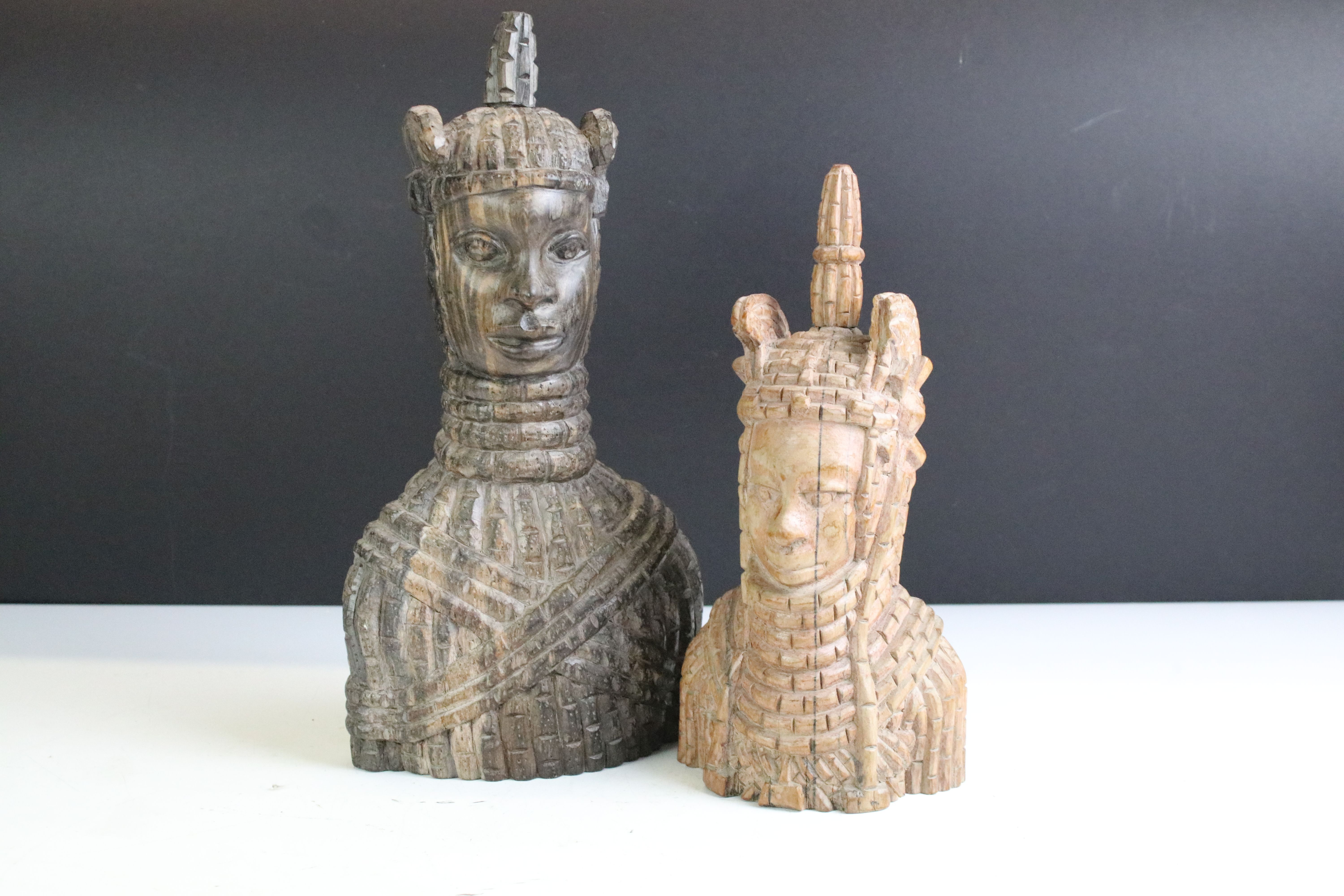 Two African tribal carved hardwood figures each with carved armour detailing. Tallest measures 32cm.