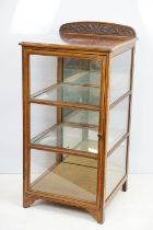 Early 20th Century Edwardian inlaid mahogany display cabinet having a mirror back with glazed panels