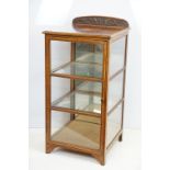 Early 20th Century Edwardian inlaid mahogany display cabinet having a mirror back with glazed panels