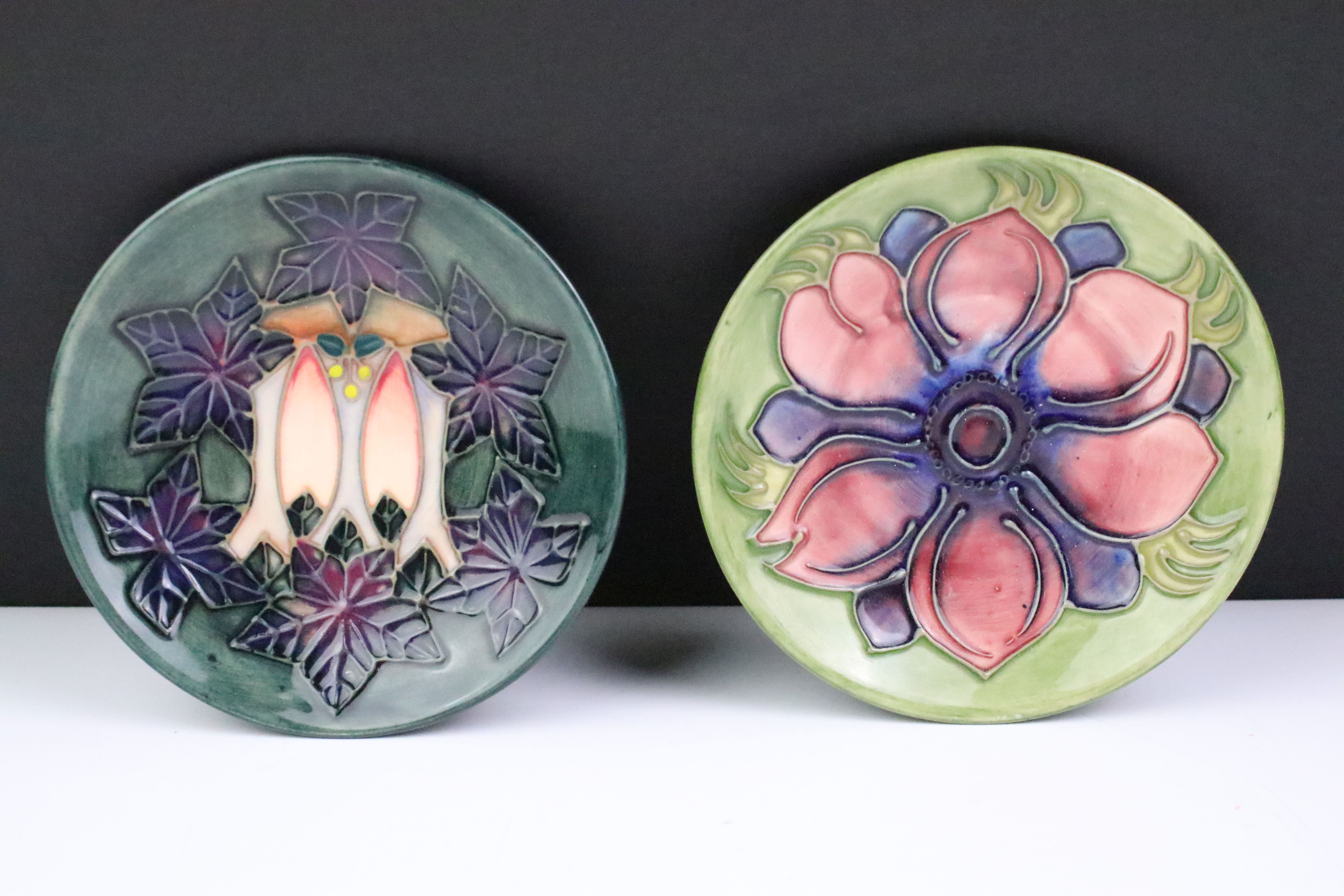 Two Moorcroft pottery pin dishes to include a Cluny pattern dish and an Anemone pattern pin dish