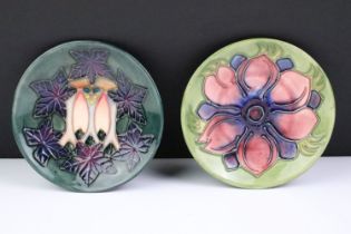 Two Moorcroft pottery pin dishes to include a Cluny pattern dish and an Anemone pattern pin dish