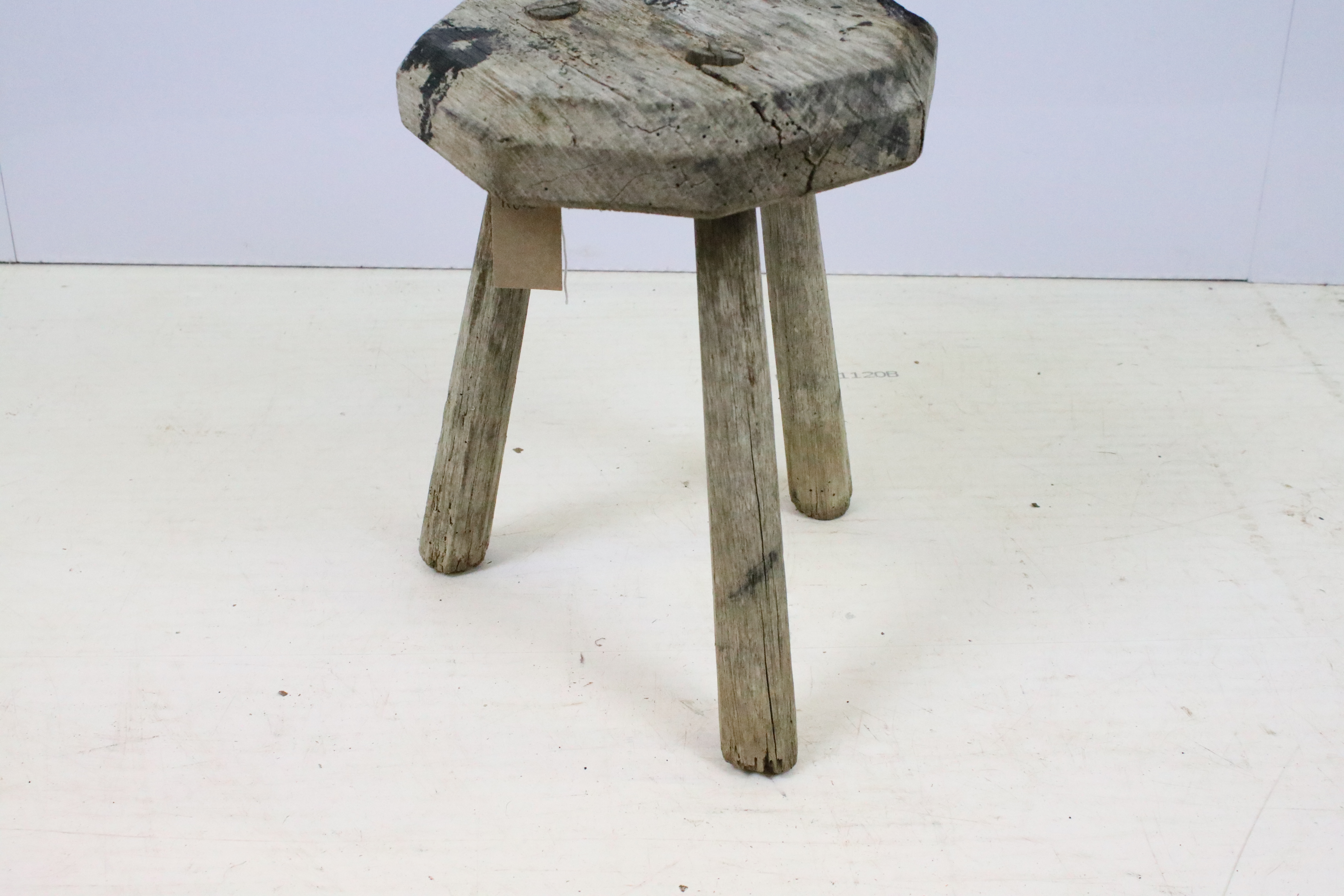 Weathered elm three legged milking stool with octagonal top. Measures 34cm tall. - Image 3 of 4