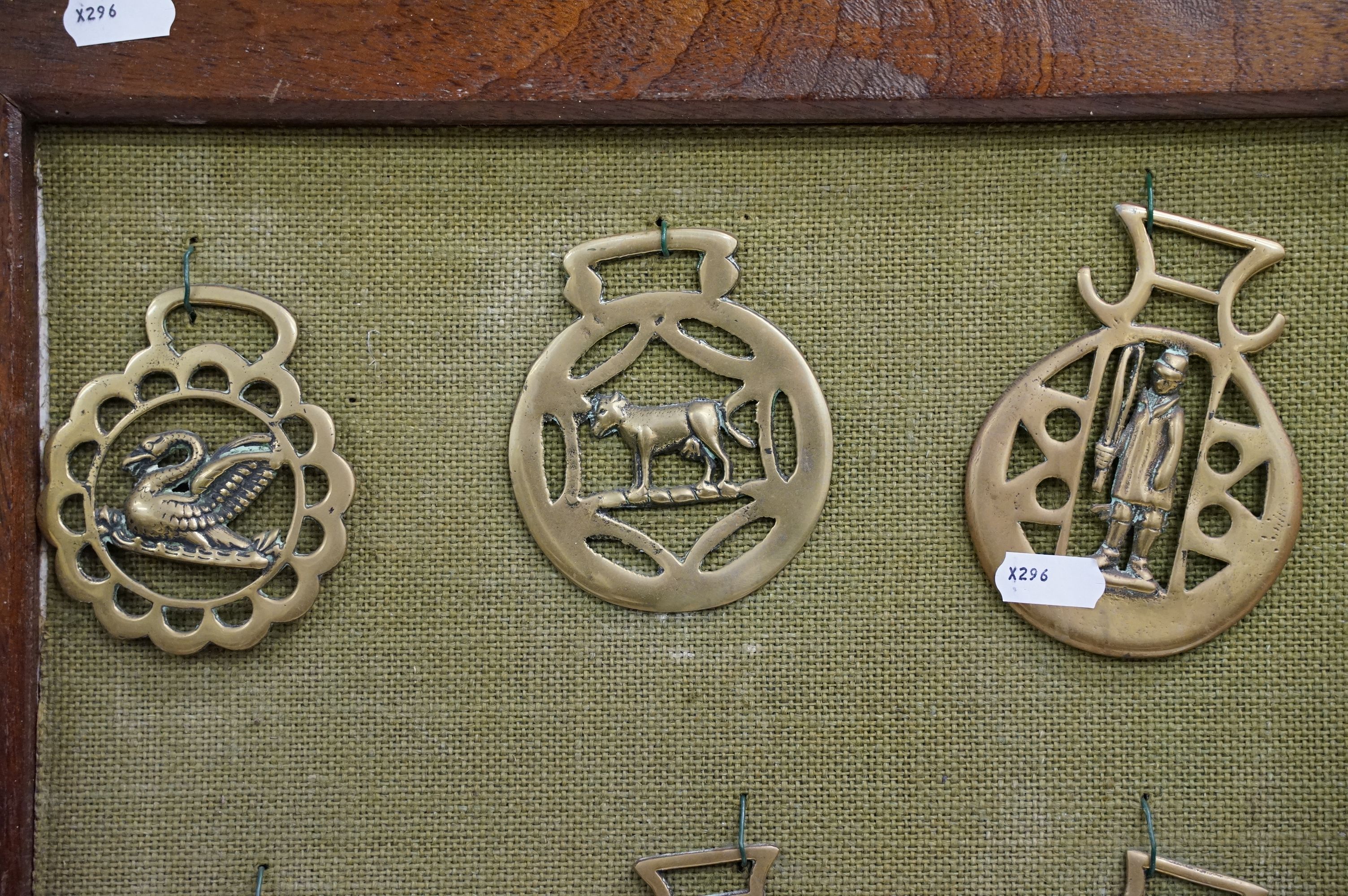 Collection of antique horse brasses mounted to canvas covered board and framed. Measures 97 x 66cm. - Image 2 of 11