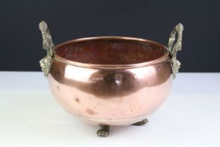 Copper Circular Planter with rolled rim and two brass lion / stag head handles and three lion paw