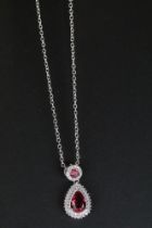Silver CZ and faux ruby pendant necklace in a pear shape