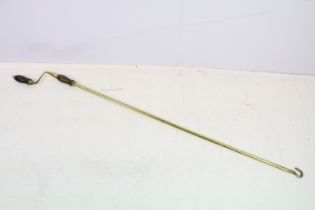 Antique style Gilt Brass and Mahogany Long Pole Turning Handle, 150cm long