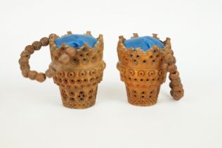 Pair of coquilla nut pin cushions