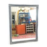 20th Century bevelled glass large framed mirror having a grey painted frame with moulded