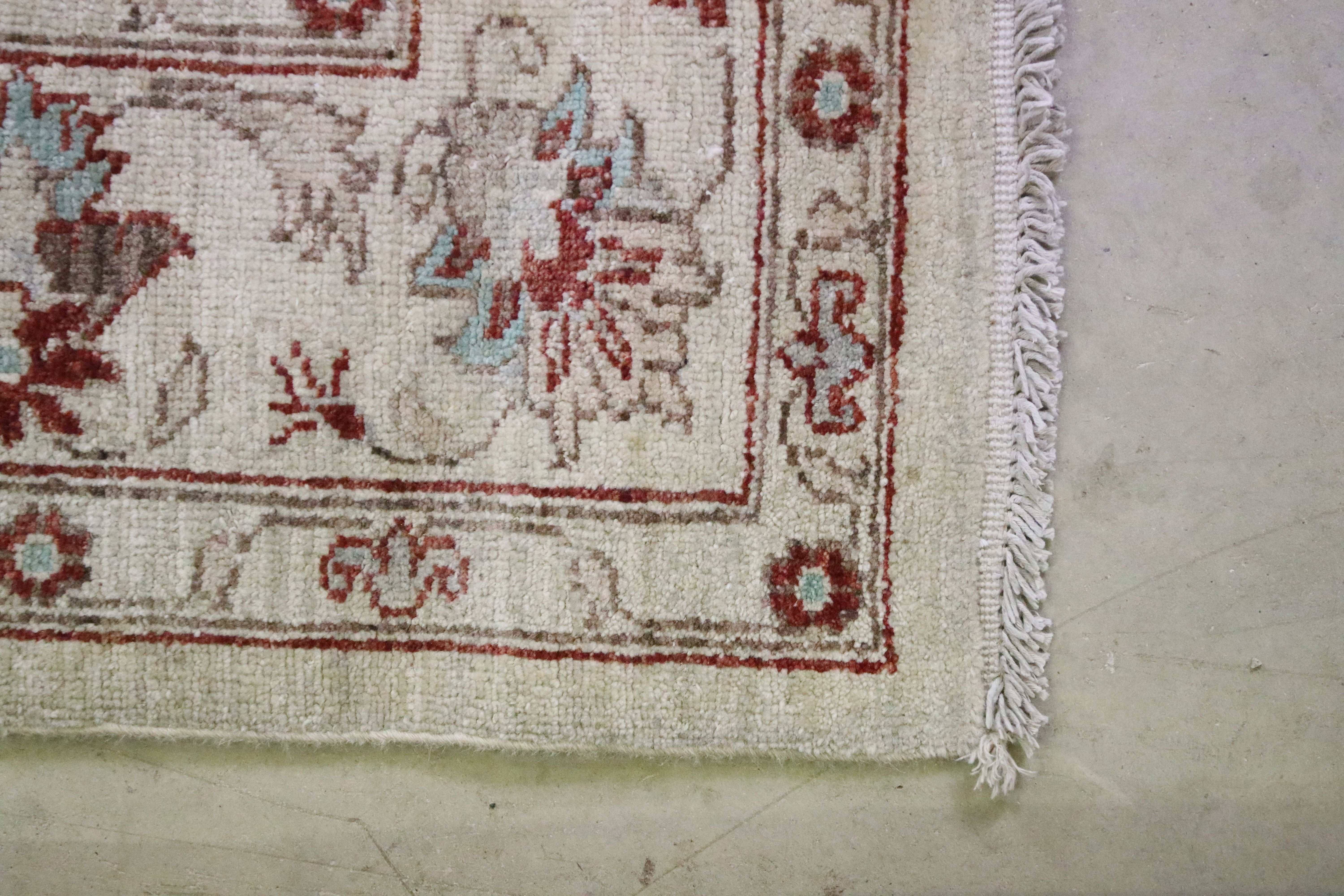 Cream ground rug with floral & leaf decoration and red & brown border, fringed to either end, - Image 5 of 7