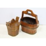 Two brass bound wooden buckets with carved detail and single handles, the largest being a coopered