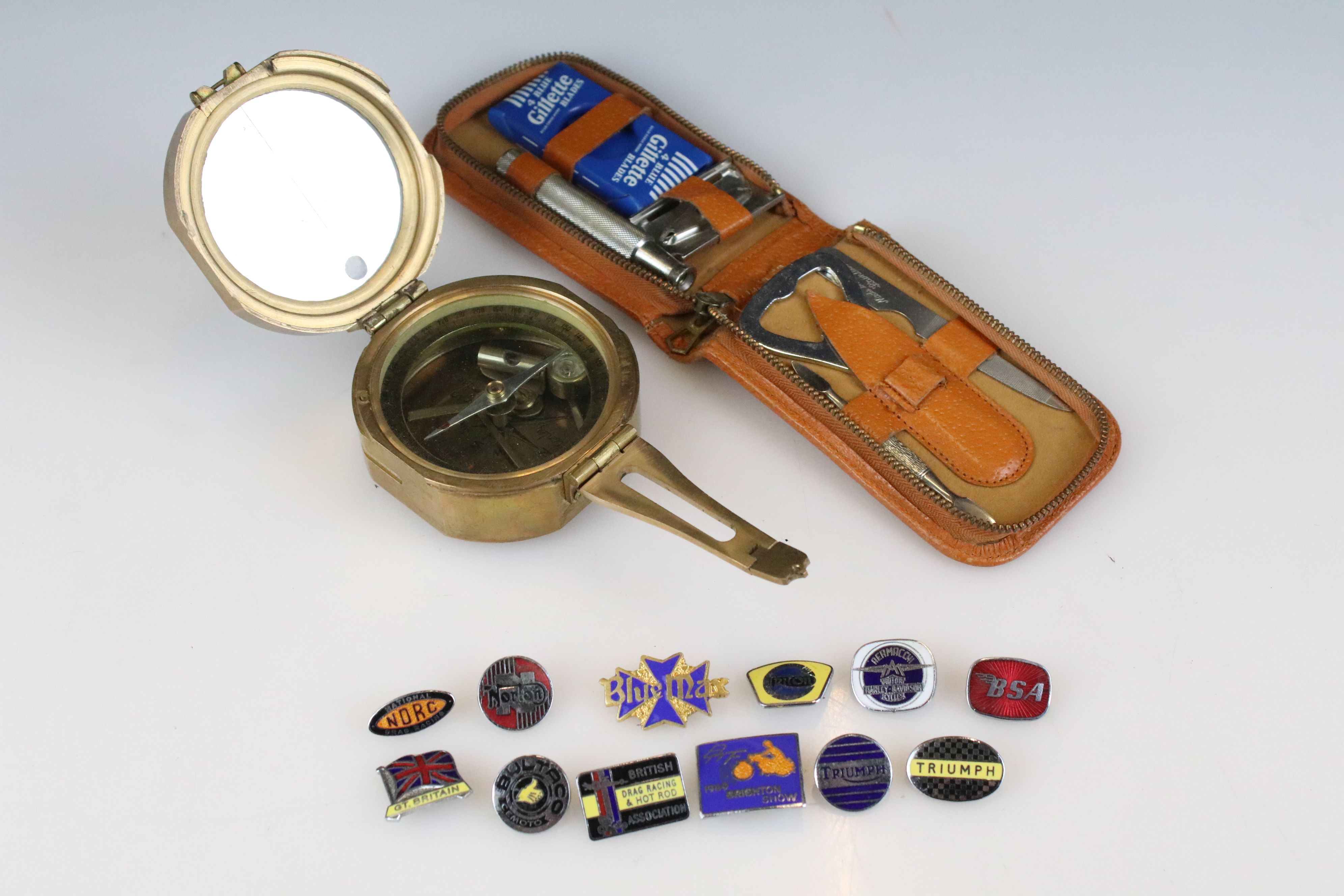 Stanley of London brass compass together with a small collection of motorcycling enamel badges (
