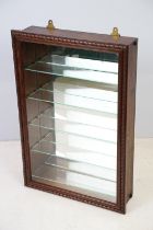 Wall hanging collectors display cabinet with 5 glass shelves and a mirrored back