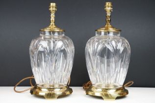 Pair of 20th century moulded glass table lamps with brass fittings & bases, approx 38cm tall