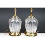 Pair of 20th century moulded glass table lamps with brass fittings & bases, approx 38cm tall