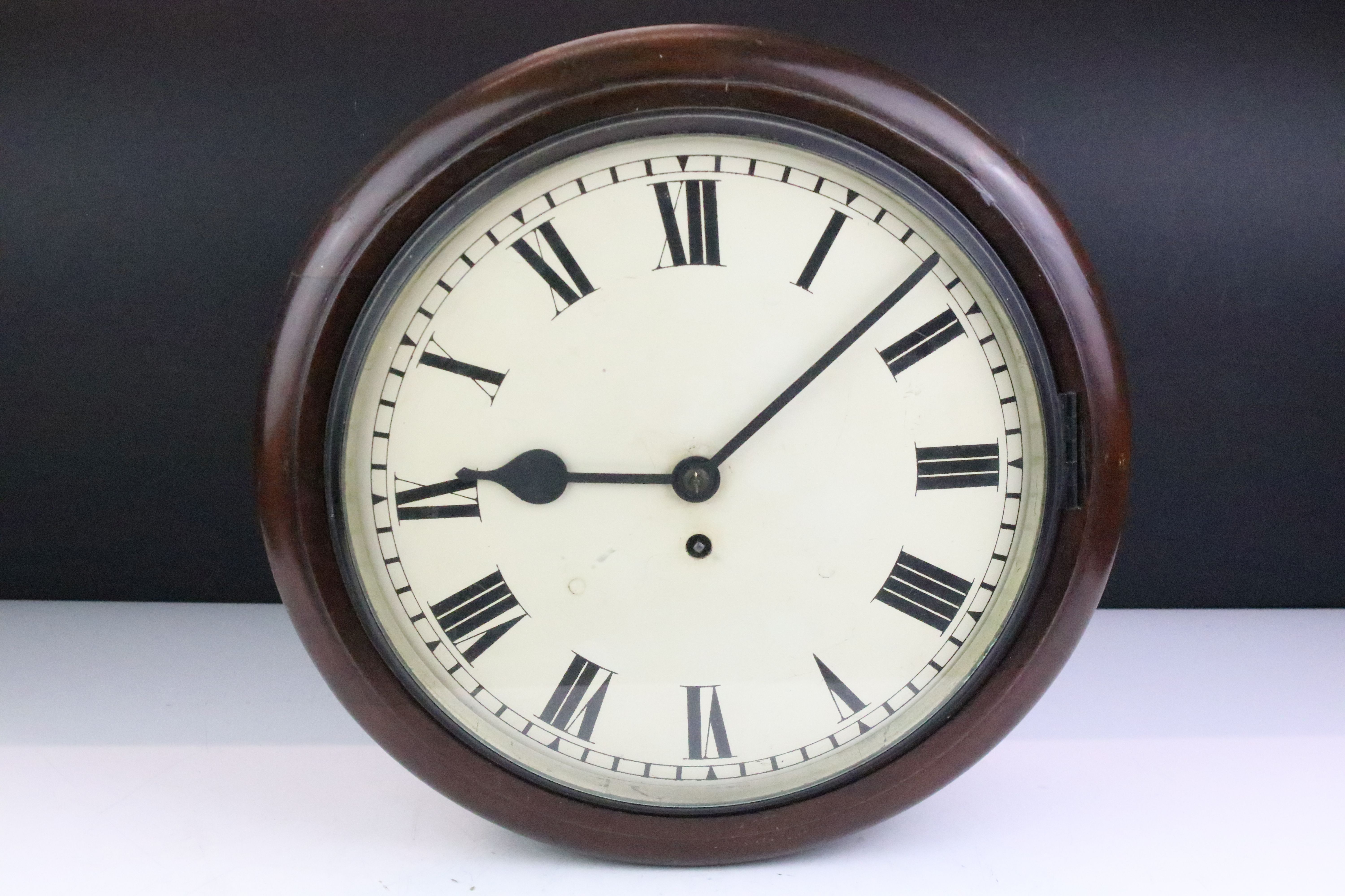 Early 20th Century mahogany cased station wall clock having a white dial with arabic numerals to the