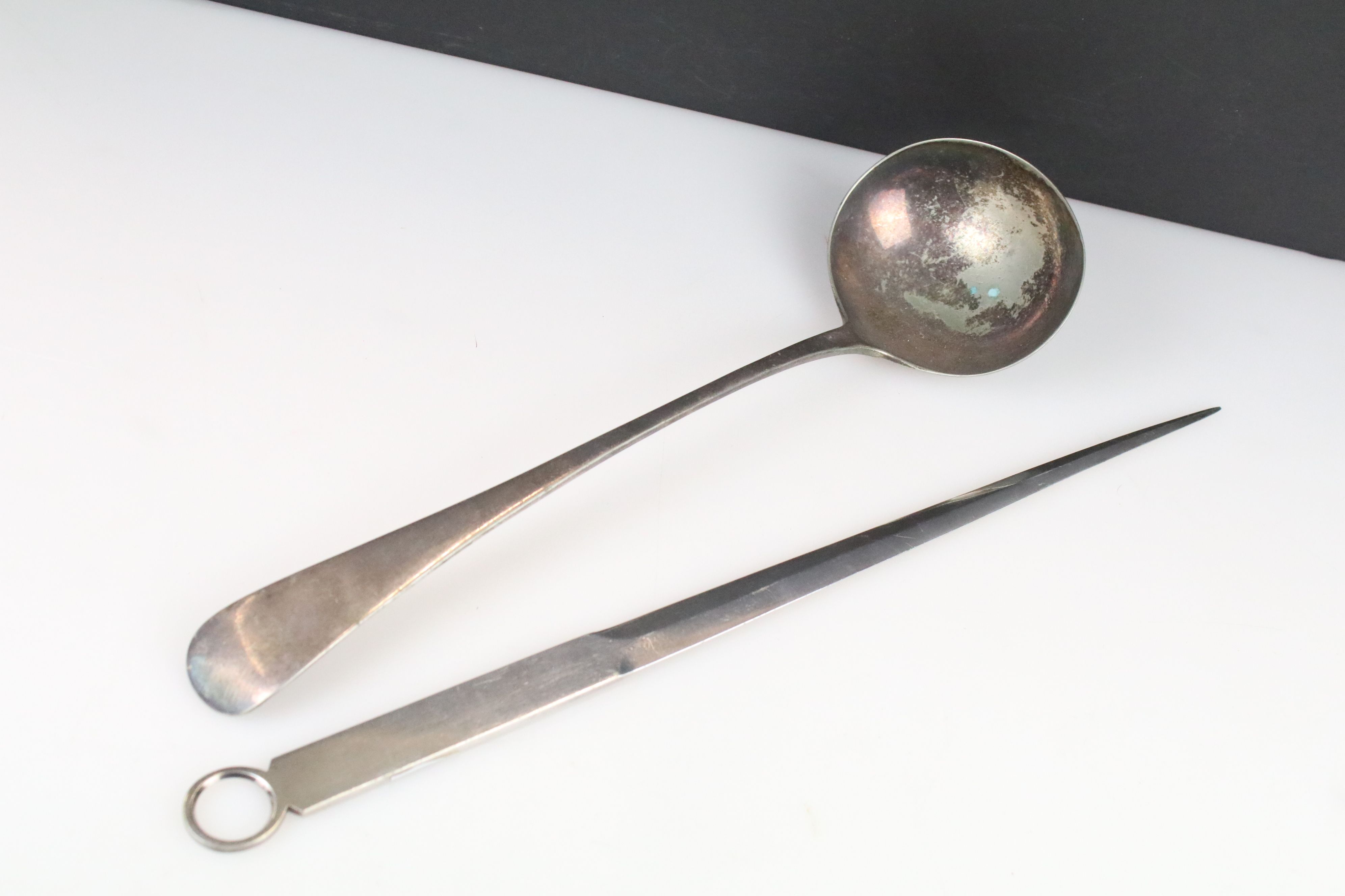 A silver plated meat skewer together with a silver plated ladle