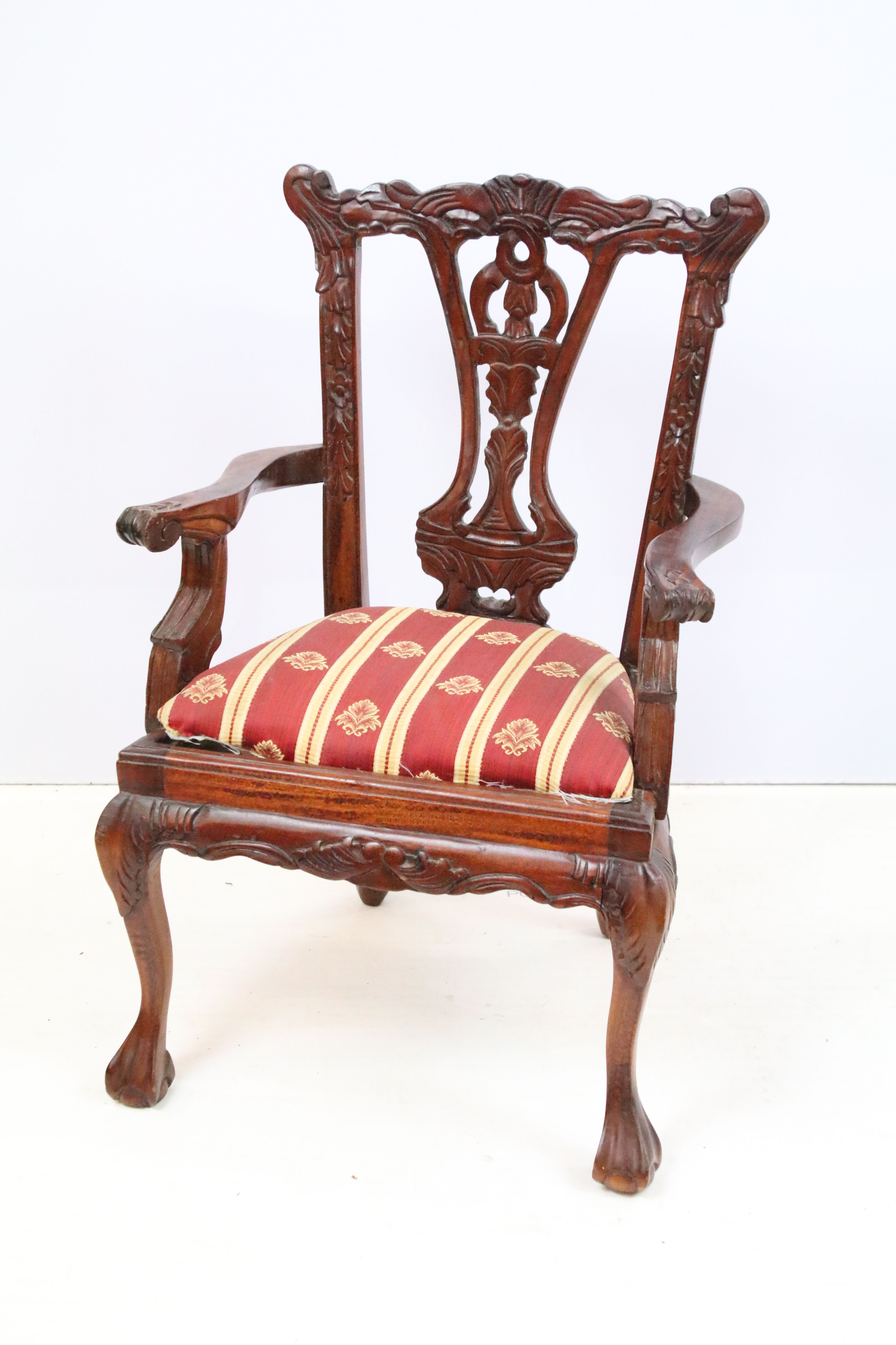 20th Century miniature chair with pierced black splat, drop in seat and ball and claw feet.