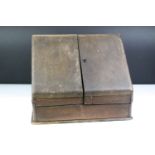 Early 20th Century oak cased desk tidy having a pair of sloped twin doors with sectional interior.