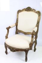 Late 19th / early 20th Century carved gilt wood arm chair having shell and foliate scrolled