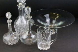 Collection of cut glass to include four decanters with stoppers, a large footed bowl and a cut glass