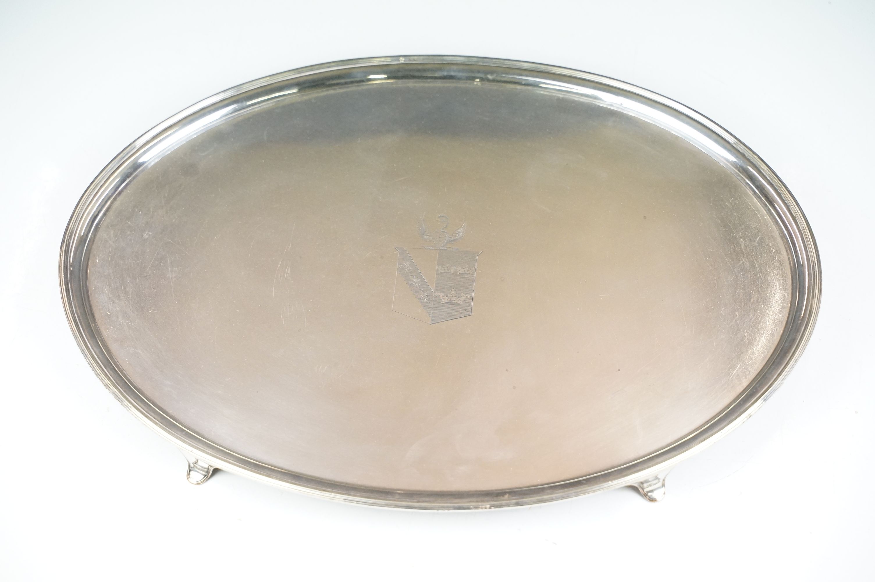 19th Century Old Sheffield silver plated oval tray raised on cabriole feet with engraved crest to